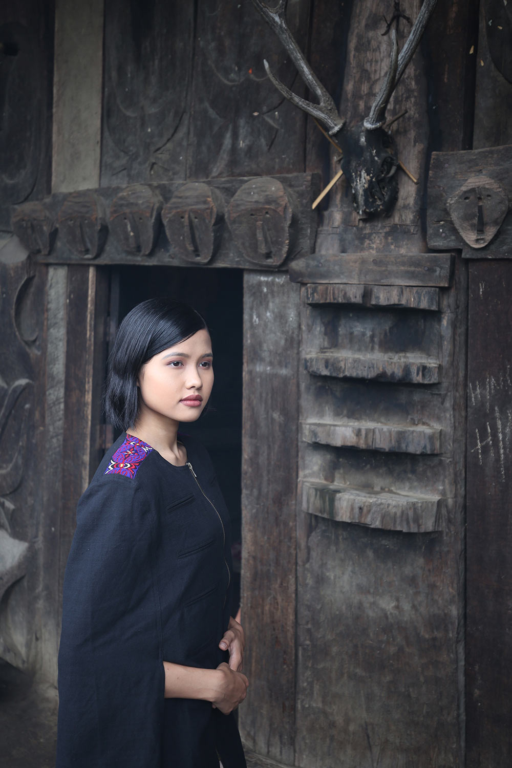 Model wearing Handwoven Military Style Cape coat, designed by Khumanthem Atelier