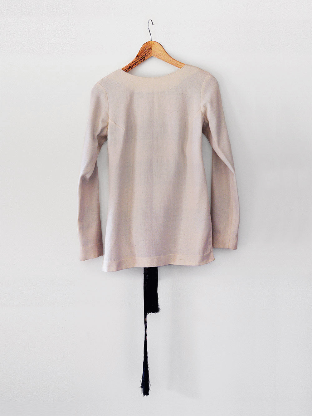 Front view of Handmade Tassled Tie-up blouse with (Shamee-Lanmee Motif), designed by Khumanthem Atelier
