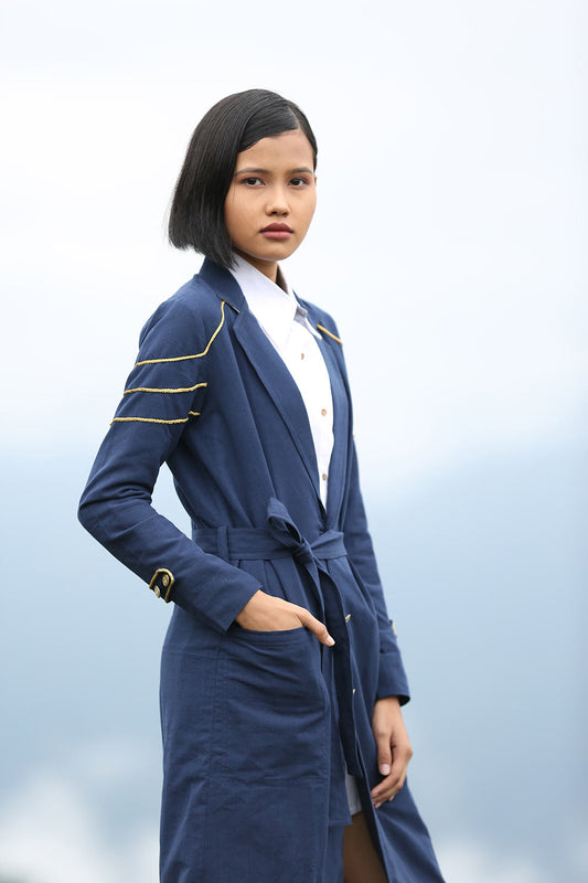 Model wearing Handwoven Trench coat with golden trims, designed by Khumanthem Atelier