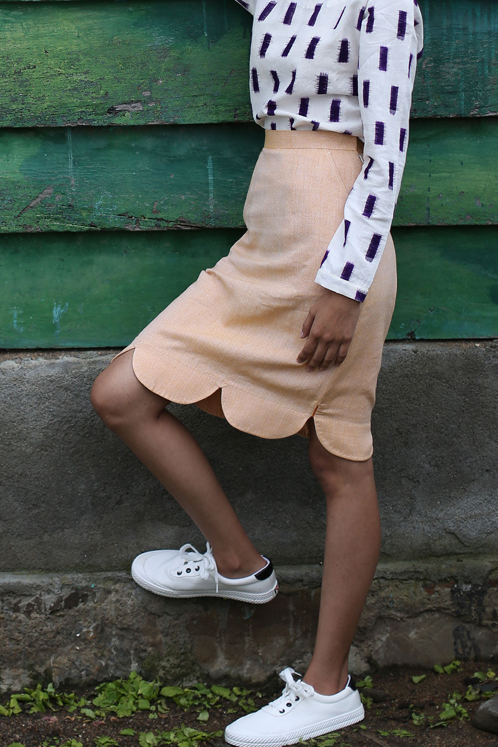 close of view of model wearing Handwoven Scallop skirt with side zipper, designed Khumanthem Atelier
