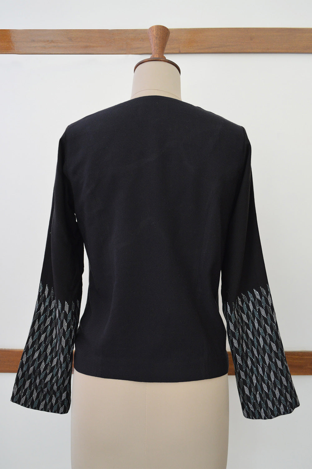 Close up back view of Handwoven Metallic weave sleeves coat for women, designed by Khumanthem Atelier