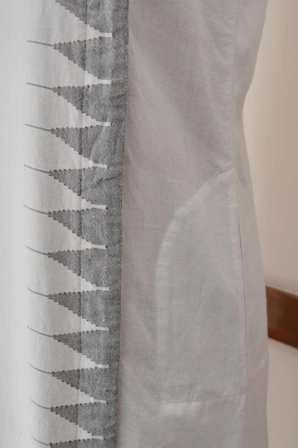 Close up view of Temple weave designs on the Handwoven Temple border design Deep pockets Tunic dress, designed by Khumanthem Atelier