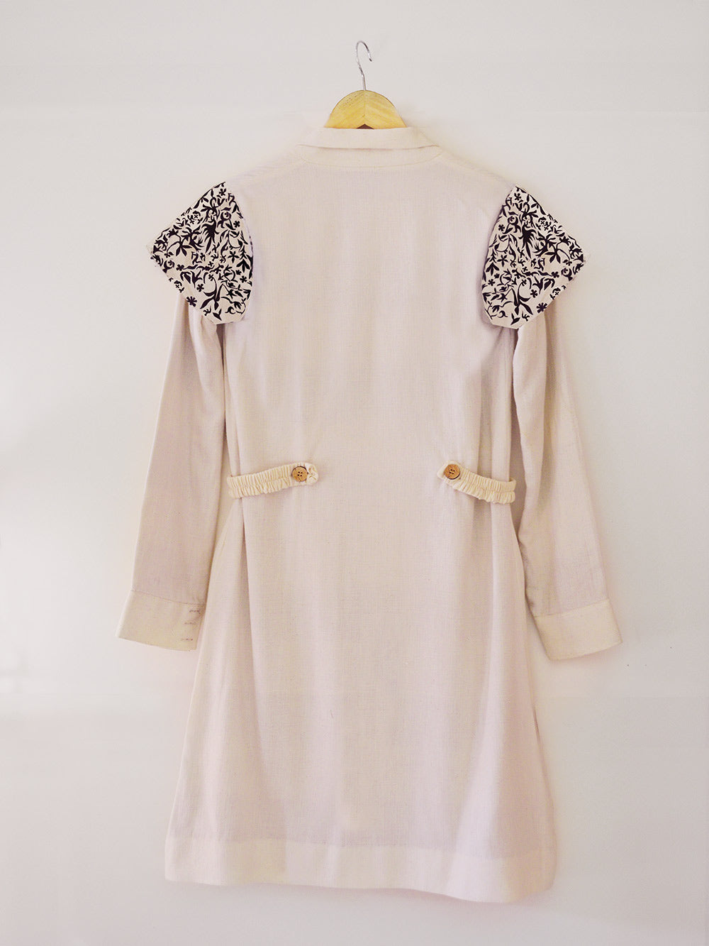 Back view of Handwoven Embroidered trench coat, unbleached white colour, designed by Khumanthem Atelier