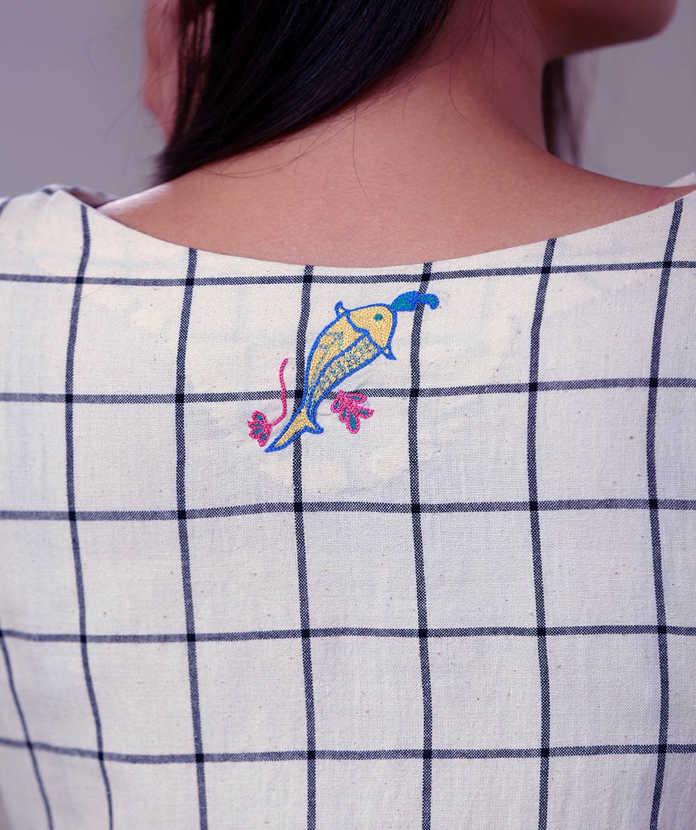 Close up view of hand embroidered checked tunic dress designed by Khumanthem Atelier
