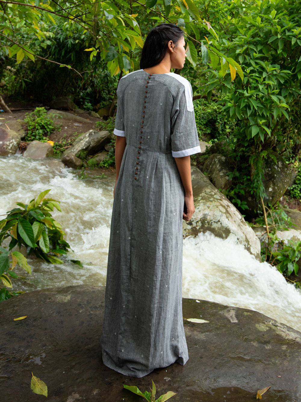 Model wearing Drawstring Cotton Maxi Dress with Pockets, designed by Khumanthem Atelier, back view