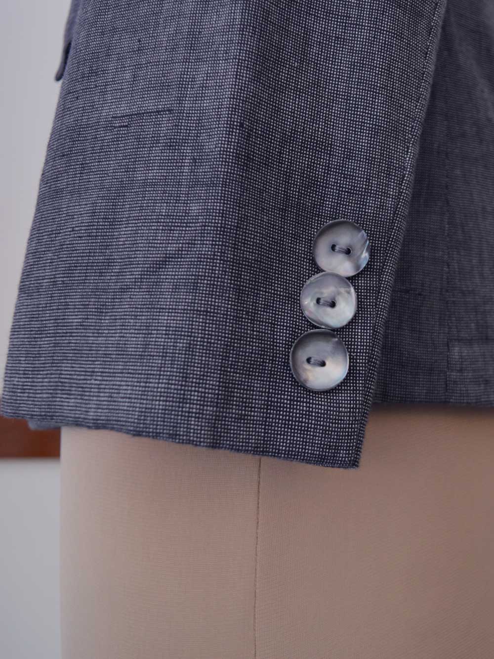 close up of the details on the sleeves of the Handwoven Single button coat with cropped trousers, designed by Khumanthem Atelier