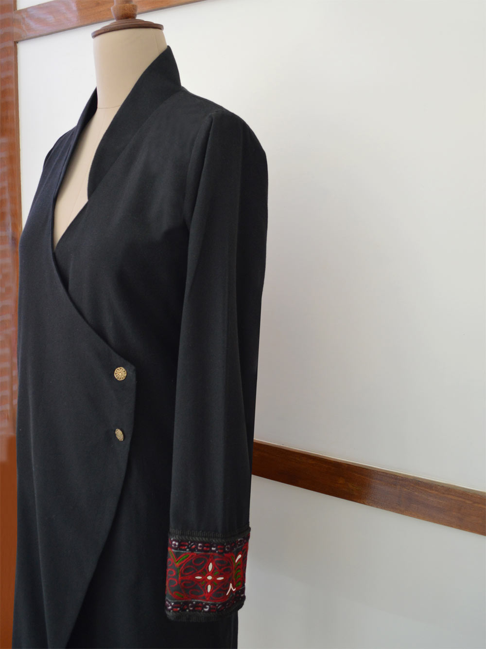 Close up view of the Hand embroidered long coat "mapan naiba motif", designed by Khumanthem Atelier