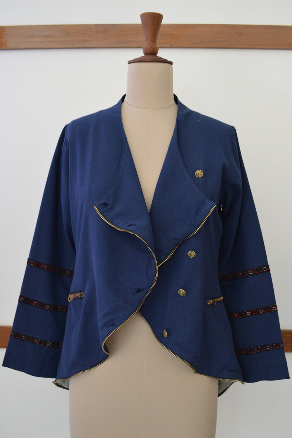 Close up front view Hand embroidered jacket with antique gold buttons and zippered pocket, designed by Khumanthem Atelier