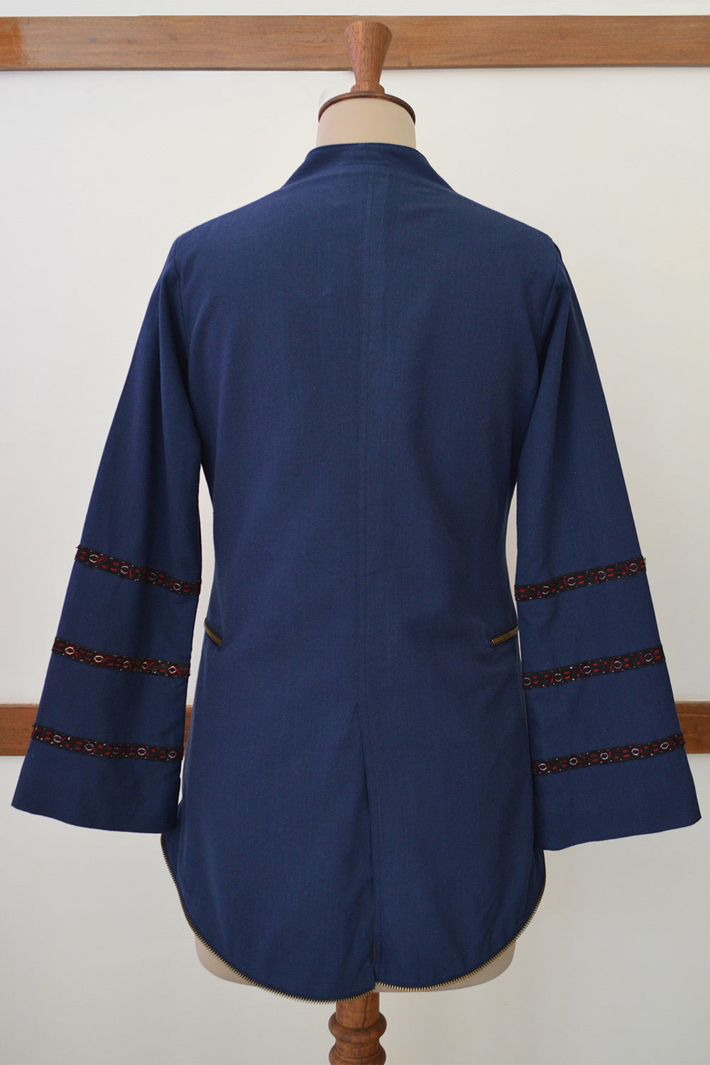 Close up back view Hand embroidered jacket with antique gold buttons and zippered pocket, designed by Khumanthem Atelier