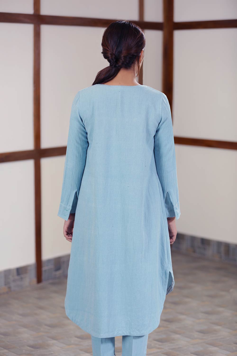 Back view of Handwoven cotton blue Twill weave reversible coat, designed by Khumanthem Atelier