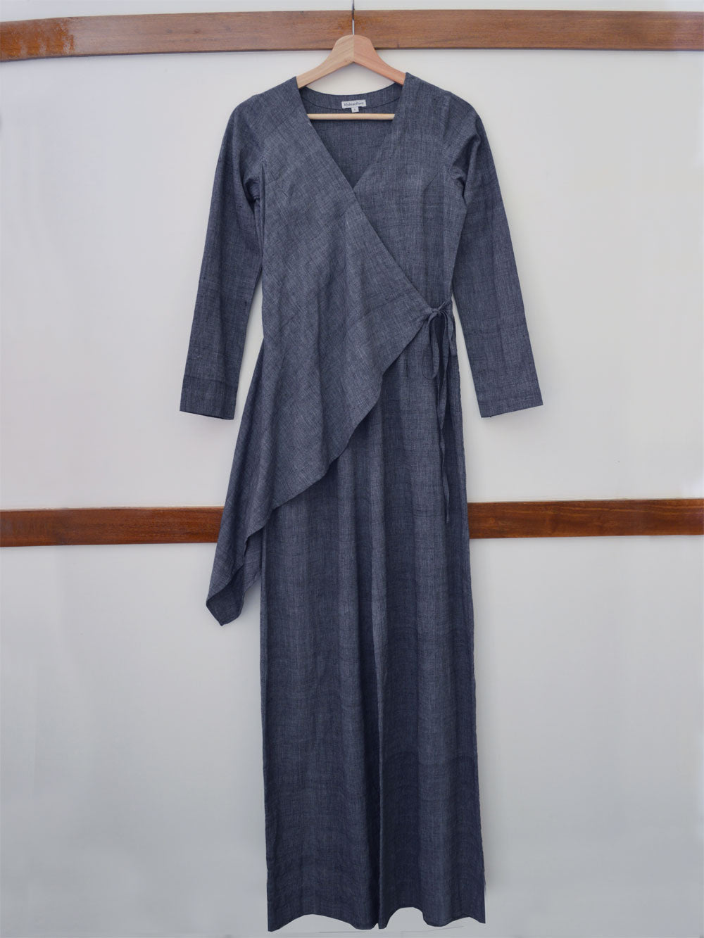 Full front view of the hanger shoot of close up view of the upper part of the V-neck jumpsuit with tie-up waist, designed by Khumanthem Atelier