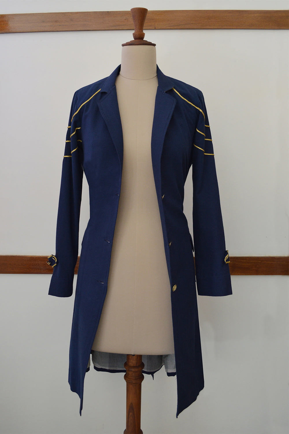 close up front view of Handwoven Trench coat with golden trims, designed by Khumanthem Atelier