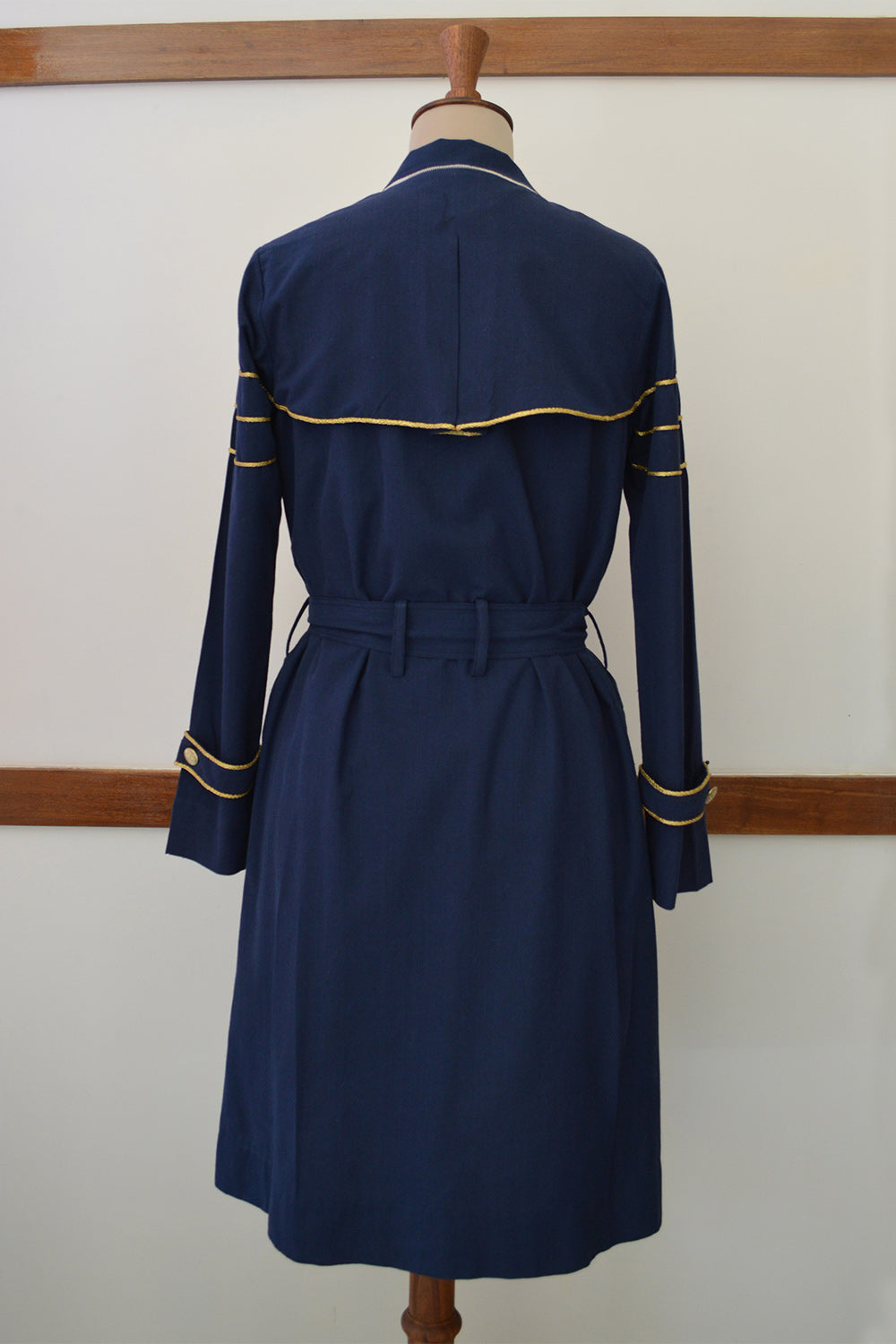 close up back view of Handwoven Trench coat with golden trims, designed by Khumanthem Atelier