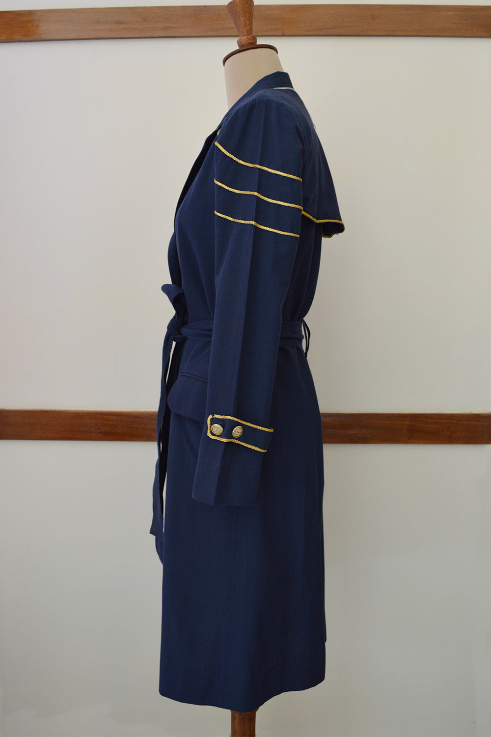 close up side view of Handwoven Trench coat with golden trims, designed by Khumanthem Atelier