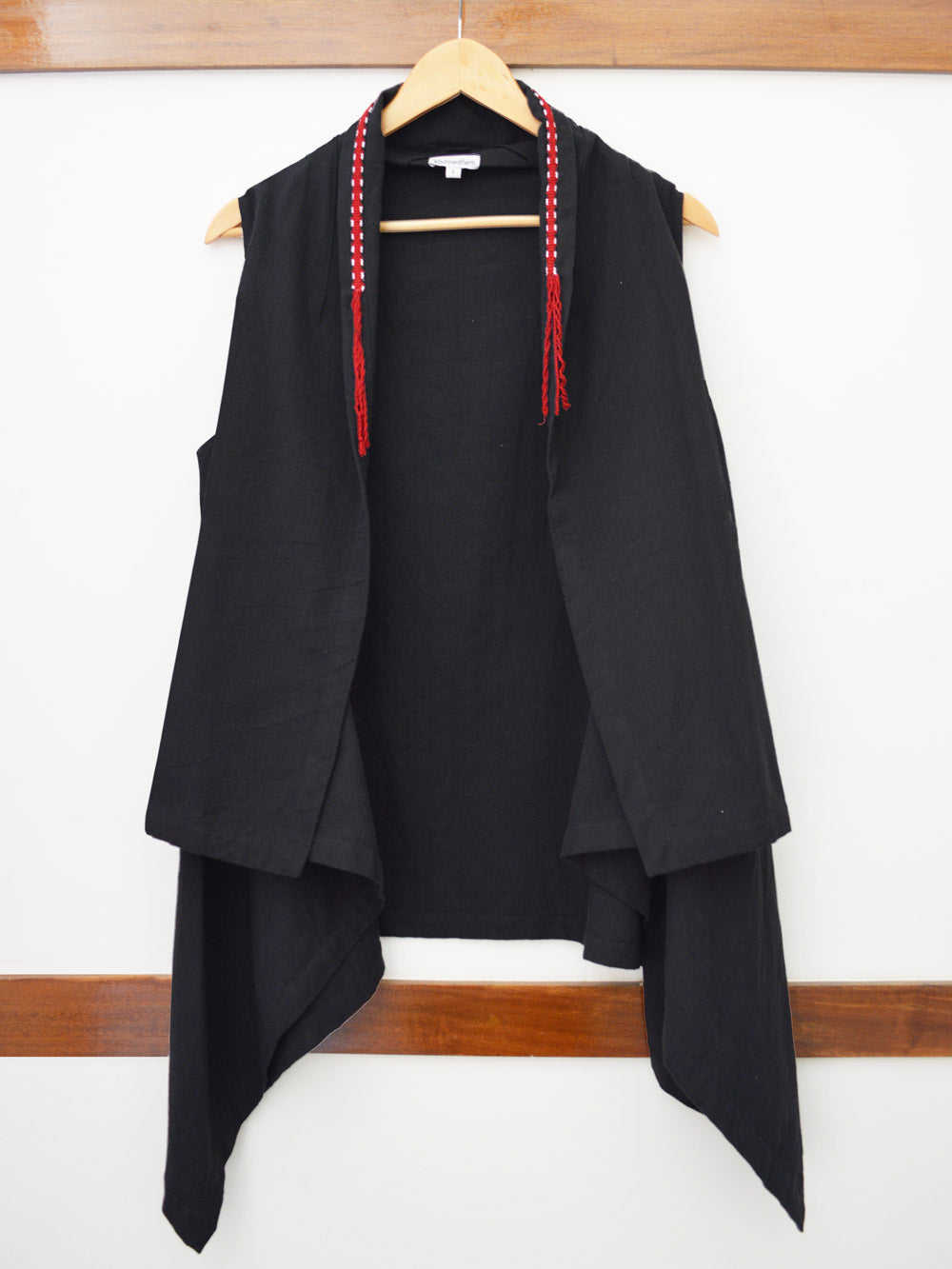 close up front view of Handwoven Sleeveless shrug with braided detail on collar, designed by Khumanthem Atelier