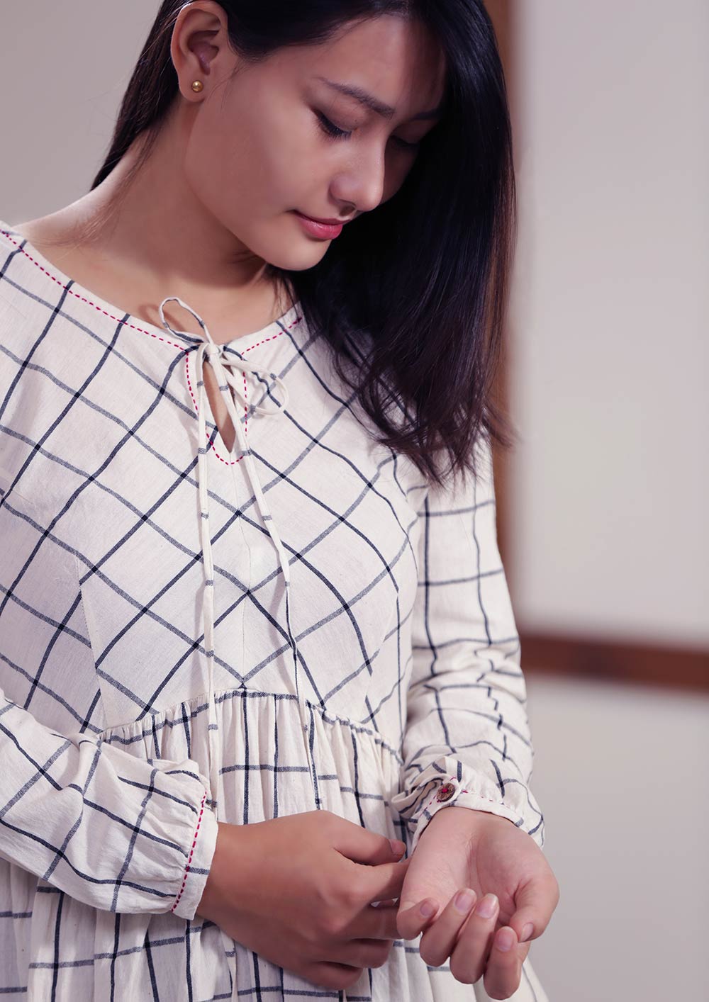 Checked peasant dress with running stitch design