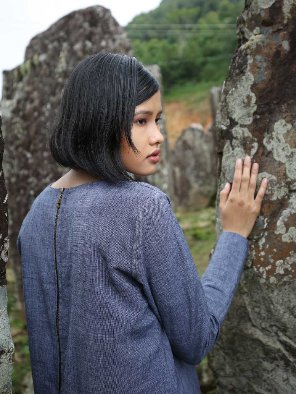 back view of model wearing Handwoven Full sleeves pleated front dress, designed by Khumanthem Atelier