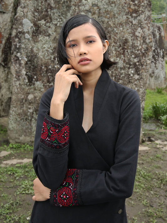 Close view of model wearing Hand embroidered long coat "mapan naiba motif", designed by Khumanthem Atelier