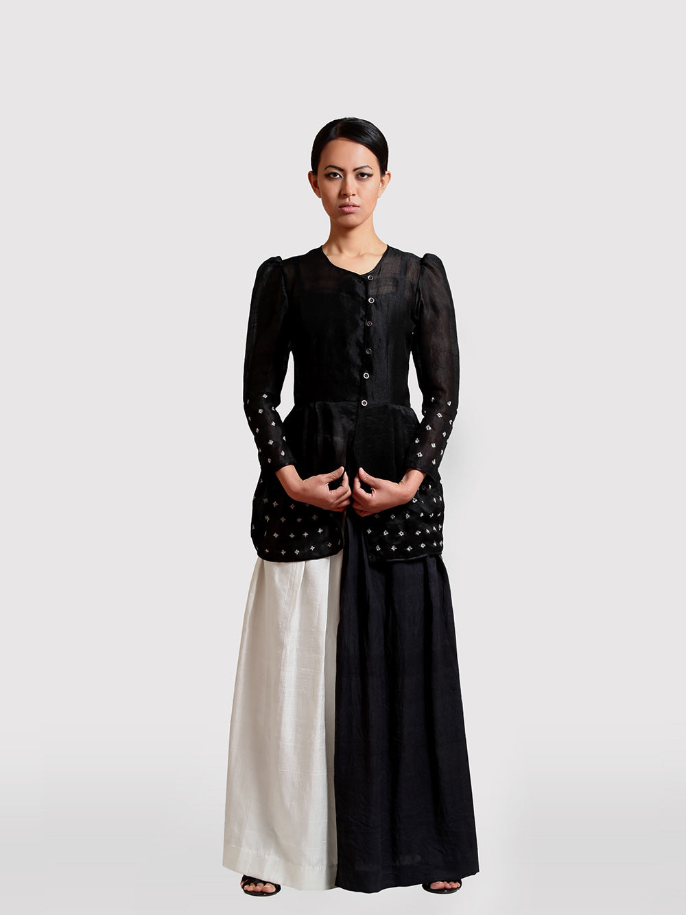Hand embroidered Sheer Black Coat with sprinkle of creme flower with puffed shoulder handmade from mulberry silk designed by Khumanthem Atelier