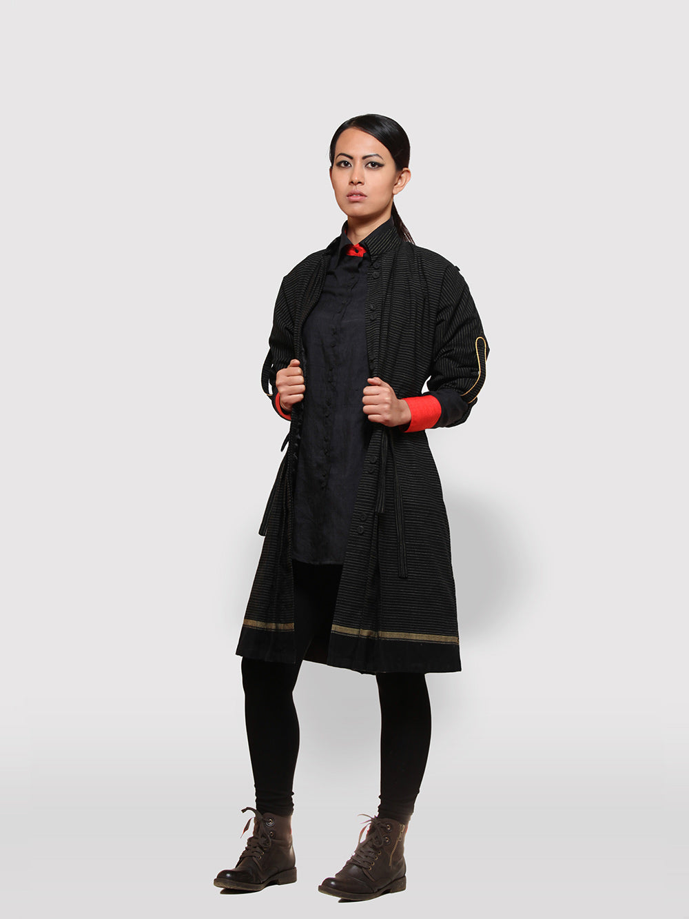 Double Belt Pleated overcoat with black and golden stripes designed by Khumanthem Atelier