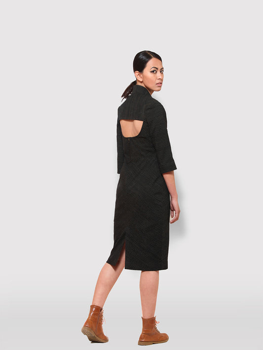 Model posing wearing Black and gold striped Paneled midi dress with cut out back designed by Khumanthem Atelier