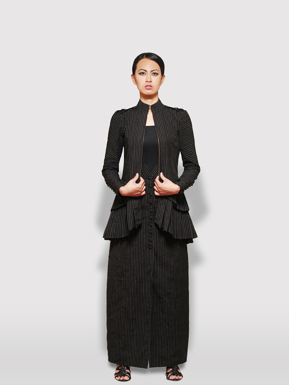Black and gold stripe tiered jacket designed by Khumanthem Atelier