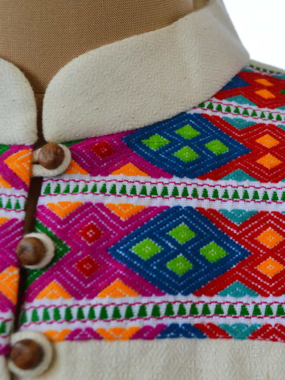 A close up view of the Chothe weave details on the short coat designed by Khumanthem Atelier