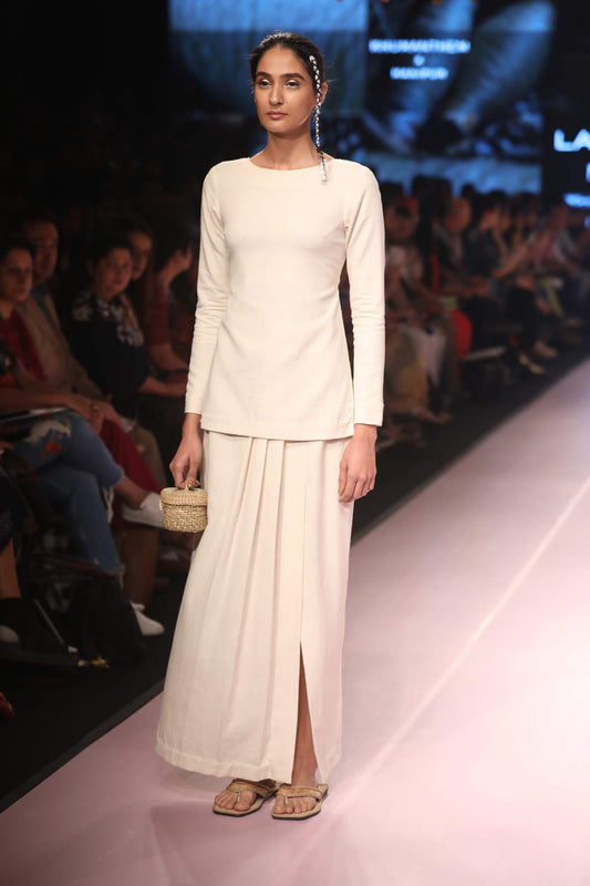 Ramp walk view of model wearing Handmade Tassled Tie-up blouse with (Shamee-Lanmee Motif), designed by Khumanthem Atelier during Lakme Fashion Week 2018