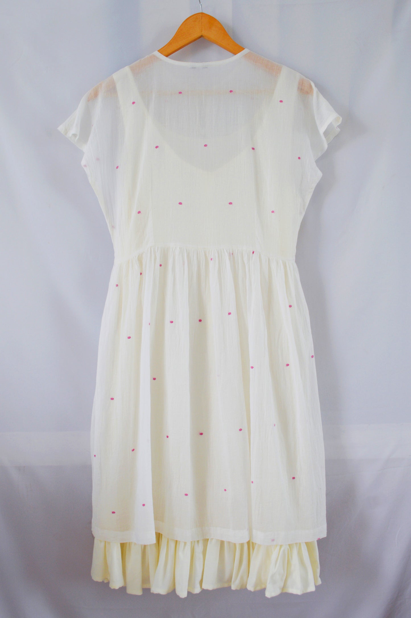 Hanger shoot of Handwoven Gathered waist cotton dress, designed by Khumanthem Atelier, back view