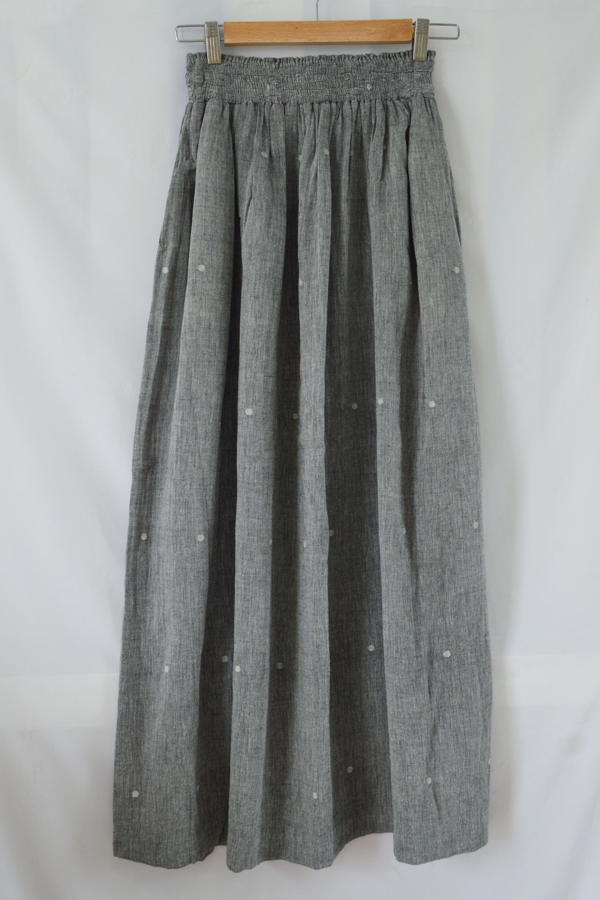 Hanger shoot back view Handwoven Elastane cotton skirt, designed by Khumanthem Atelier