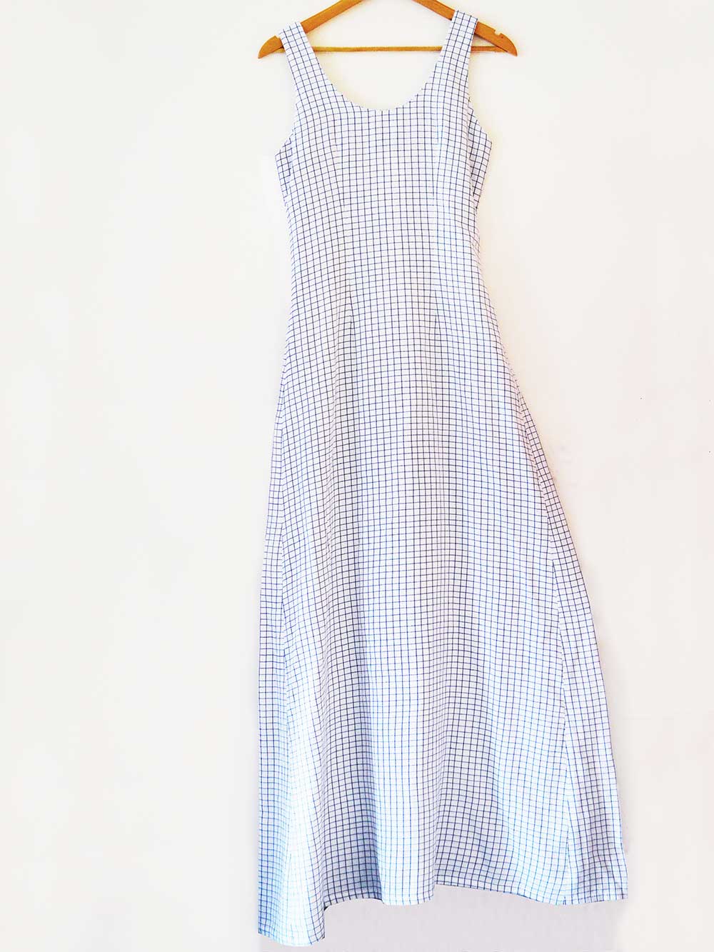 Hanger shoot of Handwoven white Checked flared maxi dress, designed by Khumanthem Atelier