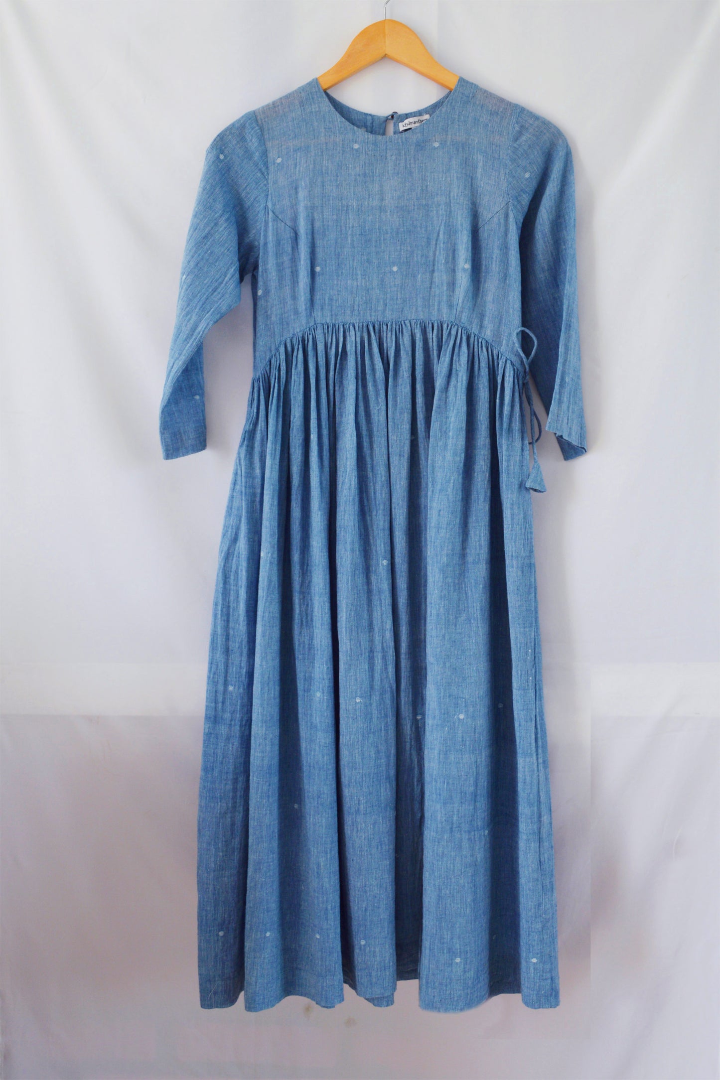 Front view of hanger shoot of Handwoven Gathered waist cotton dress, designed by Khumanthem Atelier