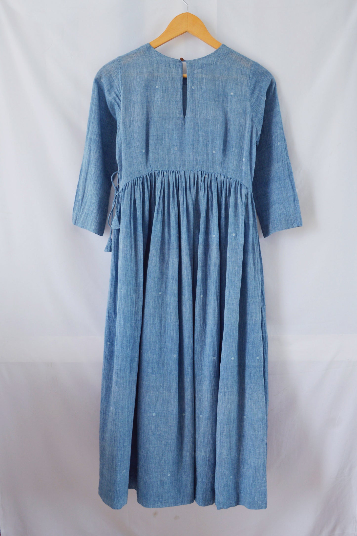 Back view of hanger shoot Handwoven Gathered waist cotton dress, designed by Khumanthem Atelier