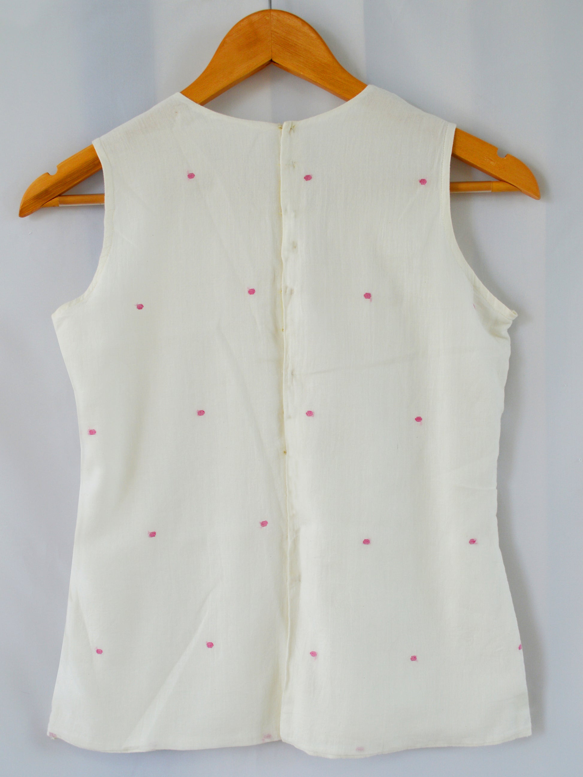 Back view of hanger shoot of Handwoven Back hooks sleeveless top