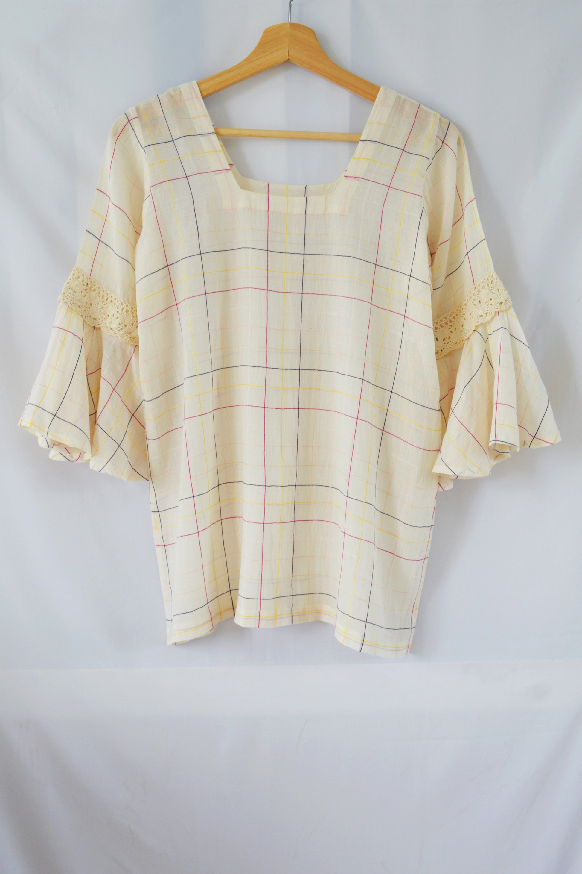 Hanger shoot Model wearing Handwoven Flounce sleeves cotton top, designed by Khumanthem Atelier, back view