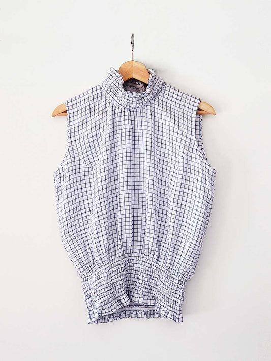white an blue checked Sleeveless top with gathered collar and waist, designed by Khumanthem Atelier