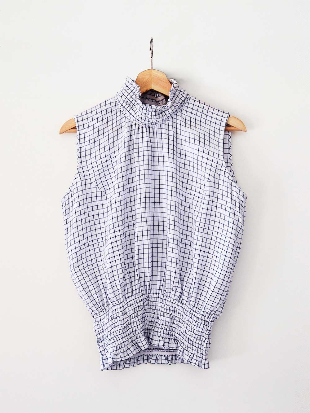 white an blue checked Sleeveless top with gathered collar and waist, designed by Khumanthem Atelier