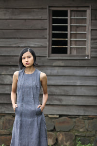 Close up front view of model wearing Handwoven Pleated maxi dress, designed by Khumanthem Atelier