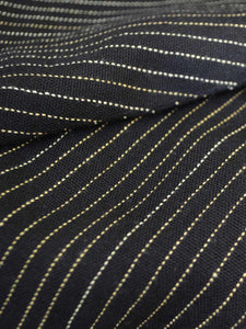 Close up view of the material of Front view of hanger shoot of Black and gold stripe tiered jacket designed by Khumanthem Atelier