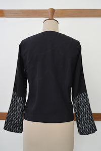 Close up back view of Handwoven Metallic weave sleeves coat for women, designed by Khumanthem Atelier