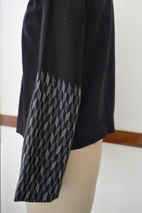 Close up side view of Handwoven Metallic weave sleeves coat for women, designed by Khumanthem Atelier