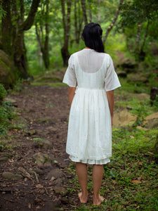 Model wearing Handwoven Gathered waist cotton dress, designed by Khumanthem Atelier, back view