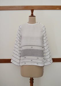 Close up front view of hanger shoot of Handwoven cotton full sleeves top with extra weft designed by Khumanthem Atelier
