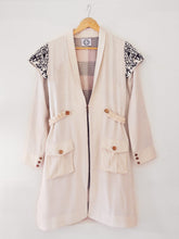 Load image into Gallery viewer, Handwoven Embroidered trench coat, unbleached white colour, designed by Khumanthem Atelier