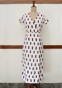 close up view of hanger shoot of Handwoven Cross-over Ikat midi dress, designed by Khumanthem Atelier