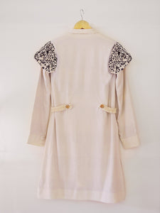 Back view of Handwoven Embroidered trench coat, unbleached white colour, designed by Khumanthem Atelier