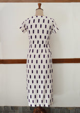 Load image into Gallery viewer, close up back view of hanger shoot of Handwoven Cross-over Ikat midi dress, designed by Khumanthem Atelier