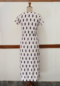 close up back view of hanger shoot of Handwoven Cross-over Ikat midi dress, designed by Khumanthem Atelier