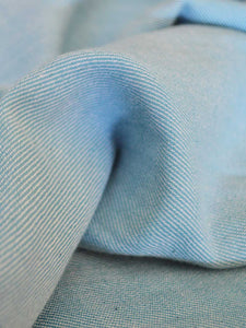 Close up of the material of Handwoven cotton blue Twill weave reversible coat, designed by Khumanthem Atelier