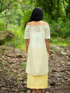 Model wearing Handwoven Off-shoulder tunic with high-low hem, designed by Khumanthem Atelier, back view.